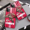 Kansas City Chiefs Gridiron Fury Phone Case on table